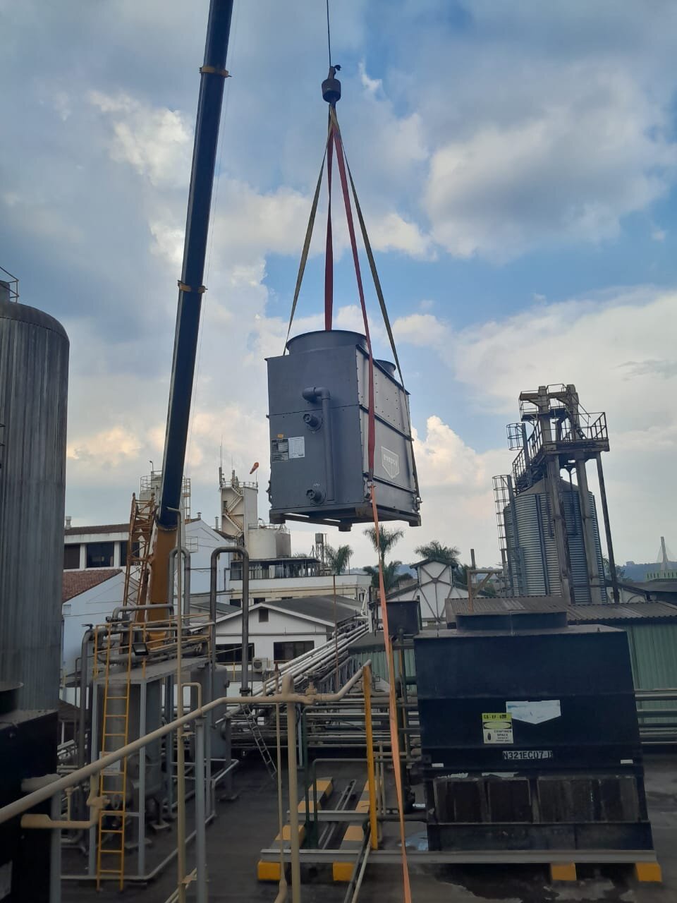 Crane lifting industrial equipment into place at a Gutari Integrated Engineering project site